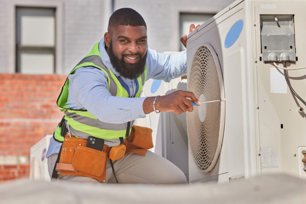 Black man, portrait and maintenance, AC repair and engineering with smile and labor outdoor. Africa