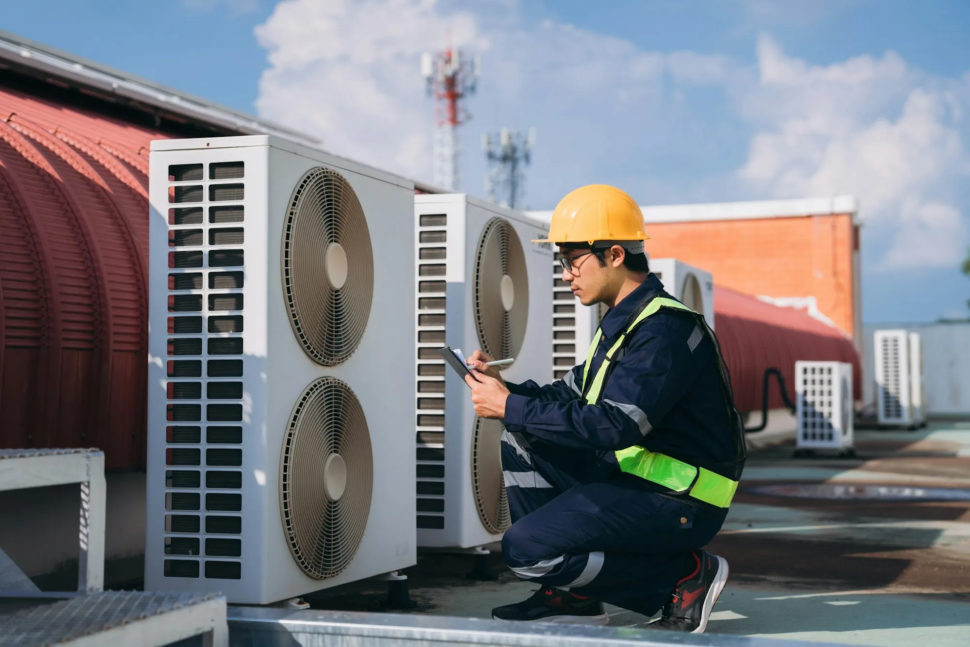 engineers is checking the air conditioning cooling system | Dan's HVAC